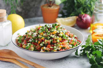 A bowl with traditional Israeli Salad