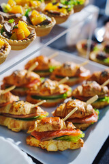 Delicious assortment of gourmet sandwiches and appetizers at a catering event