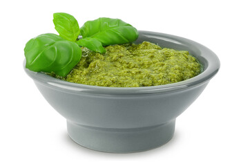 Pesto sauce in ceramic bowl isolated on white background. Top view. Flat lay