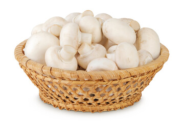 Fresh mushroom champignon in a wicker basket isolated on white background