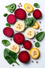 heart-healthy foods to eat daily. Colorful slices of banana, beetroot, and fresh spinach leaves arranged aesthetically on a white background, promoting healthy eating concept