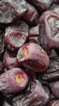 Sweet dried dates in close-up. Natural dried fruits, popular in healthy diets. The fruits of the date palm.