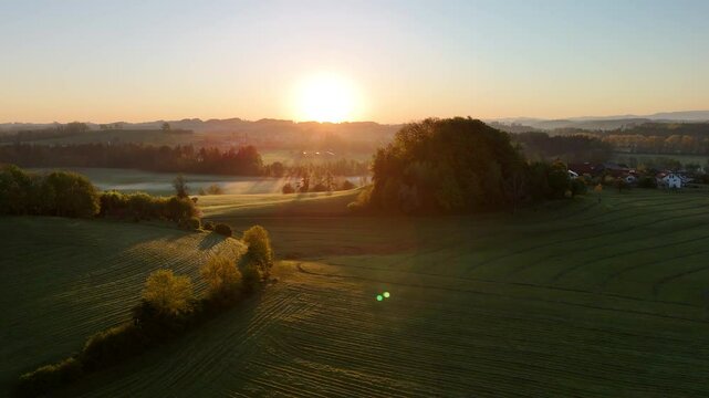Sunrise Over Rolling Hills in Southern Germany &ndash; West Allg&auml;u & Lake Constance Region. Aerial footage capturing a peaceful spring sunrise over the rolling green hills and meadows of the West Allg&auml;u 