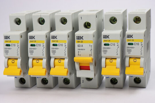 1 Pole Current Circuit Breakers from IEK for Electrical Load Protection. On a light background. 