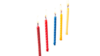Vibrant birthday candles in various colors lit with flames isolated on transparent background