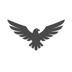 Fototapeta premium soaring Eagle Silhouette: A graphic, bold silhouette of an eagle with widespread wings against the sky. The majestic bird embodies power, freedom, and ambition. 