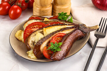 Baked tomato with mozzarella and tomato