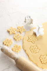 raw cookie dough pressed with cookie cutter