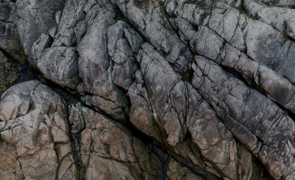 Close-up view of textured gray and brown rock formations, showing intricate patterns and crevices