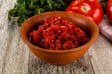 Diced ripe tomato with sauce