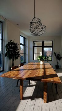 Wide-angle shot of a modern dining room with a wooden table, geometric chandelier, and large windows, ideal for a home decor video.