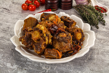 Baked oztail with tomato and carrot