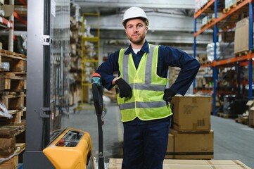 portrait of a smiling young warehouse worker working in a cash and carry wholesale store