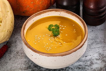 Vegan pumpkin cream soup served sesam
