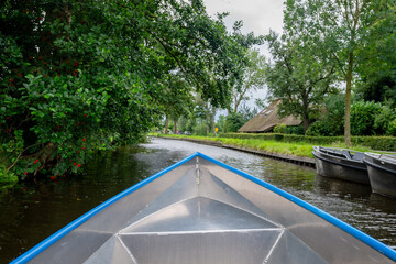 Landscape view of famous Giethoorn village in Netherlands with canals and wooden bridges
