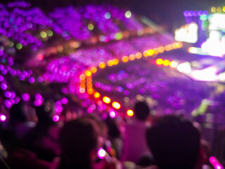Blurred images of the atmosphere of light, color, sound, and a grand concert performance in a spacious hall.