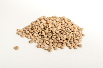 Lupine seeds on white background. A bunch of lupine seeds