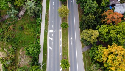 Fototapeta premium A safe road with signs, sidewalks, and trees, top-down perspective