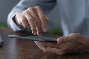 Businessman using digital tablet create business idea at home office