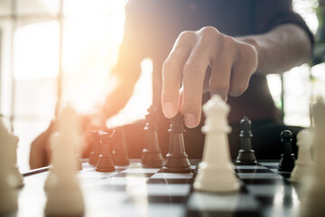 Businessman moving chess.business strategy ideas concept Plan leading strategy of successful business competition