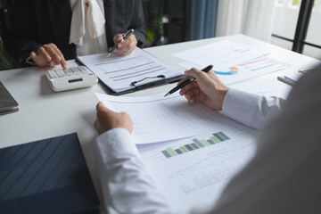 Financial inspector calculating a numbers in office room