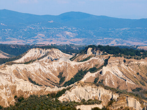 Tuscany Le Balze erosion landscape, clay ridges shaped over centuries, panoramic view of Italian badlands, unique natural attraction, rural geological marvel. Travel