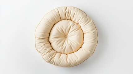 Obraz premium Round Cream Cushioned Pillow on White Background with Button Detail