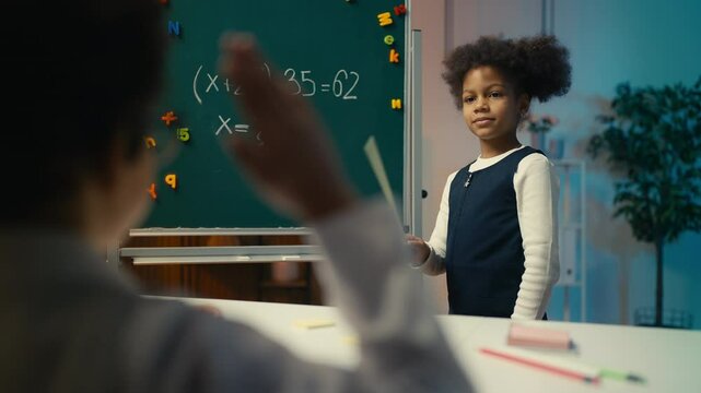 Cute African American siblings roleplaying math teacher and pupil during lesson