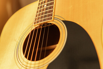 Obraz premium close-up of an expensive-looking acoustic guitar 
