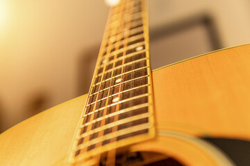 close-up of an expensive-looking acoustic guitar	
