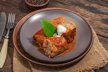 Cabbage rolls stuffed with rice and meat stewed in tomato sauce. Traditional dish, ready-to-eat food