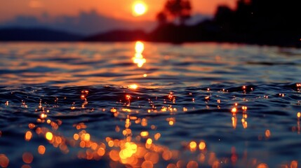Beautiful sunset reflects golden light across rippling water surfaces