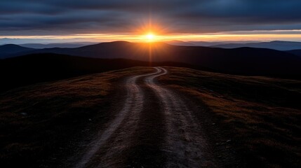 Fototapeta premium Mountain sunset, winding dirt road
