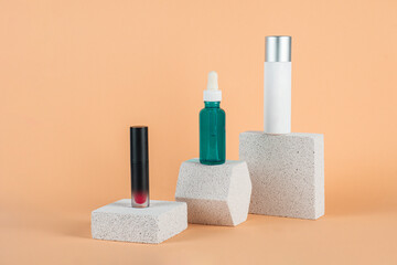 Plastic white tube for cream or lotion. Skin care or sunscreen cosmetic with stylish props on cream background.