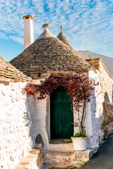 beautiful pretty vintahe houses with blue cloudy sky on background. old mediterranean home for...