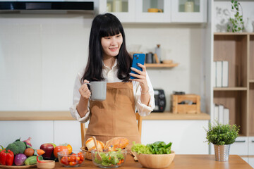 Fit woman enjoying preparing healthy breakfast in kitchen. Fitness, Nutrition, Home Lifestyle.