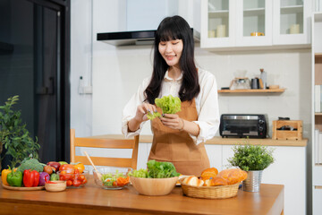 Fit woman enjoying preparing healthy breakfast in kitchen. Fitness, Nutrition, Home Lifestyle.