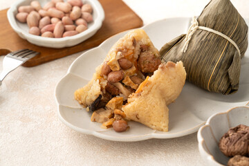 Zongzi, rice dumpling for Dragon Boat Festival on white table background.