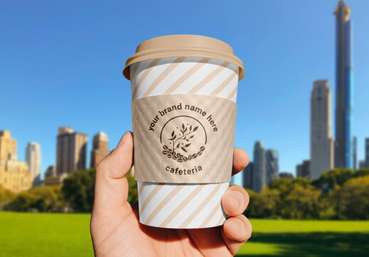 Paper Cup Sleeve in Hand Mockup