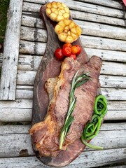 Close up Steak on wood plate.