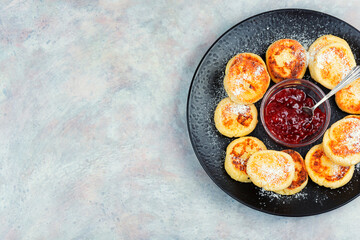 Homemade cottage cheese pancakes syrniki.
