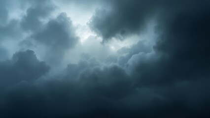 Fototapeta premium Dark stormy clouds forming in the sky before a rainstorm. Ideal for weather, nature, and dramatic backgrounds