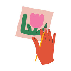 Hand draws a flower with a brush