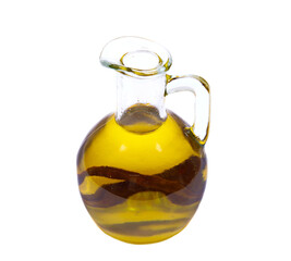 Bottle of olive oil with olive leaf inside isolated on white background.