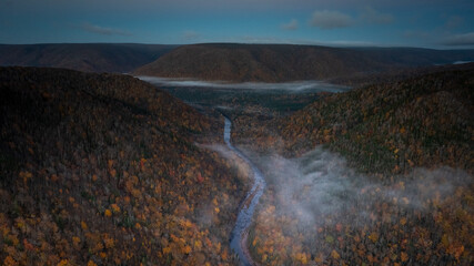 The Northeast Margaree River on Cape Breton Island, Nova Scotia, Canada at dawn with low fog.