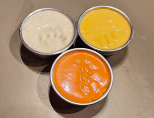 close up. Three Dipping sauce cup with condiments 