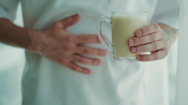 Pain in the stomach with milk poisoning.
Poisoning with stale products.
Sour milk in a glass.
Pain in the stomach with poisoning. stale milk drink.
Expired milk