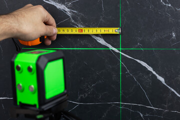Laser level when building a wall of blocks. laser level for determining precise lines and levels at construction sites