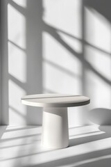 Fototapeta premium Elegant minimal round table in stark white setting casting shadows creating depth for product showcase