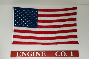 Americn flag mounted on the wall of a fire station in northern California.